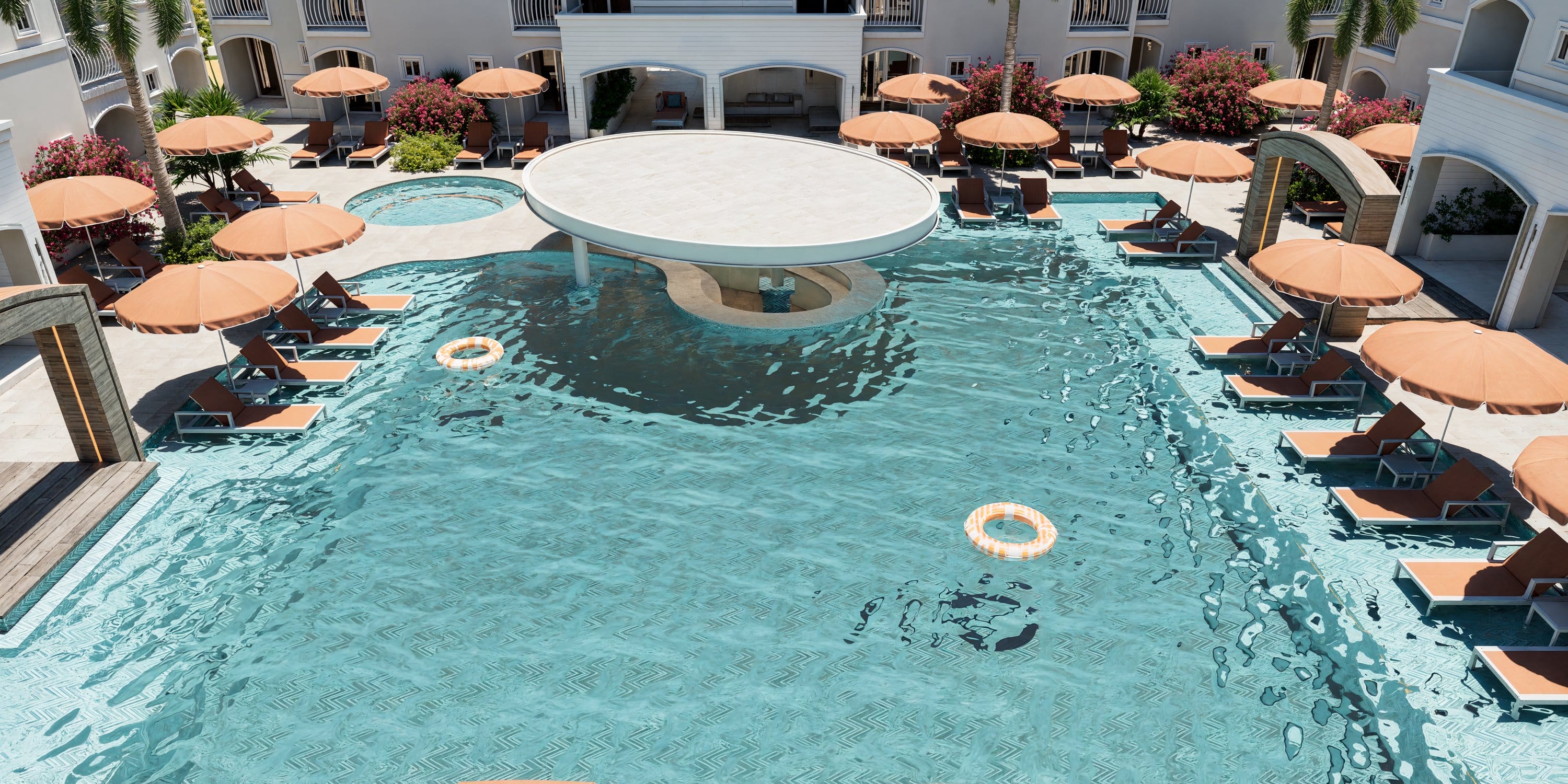Royalton CHIC Antigua resort pool with a swim-up bar, perfect for a destination wedding.